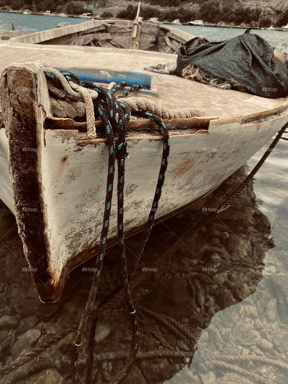 An old wooden fishing boat representing the simple quiet life of a seaside village in the Adriatic Sea. 