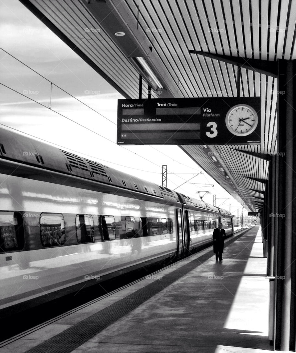 Train riding through train station