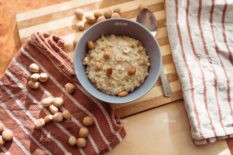 Cooked oatmeal in a deep gray plate.