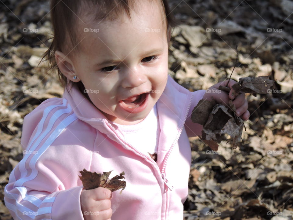 Baby discovers leaves. Baby discovers  leaves for the first time