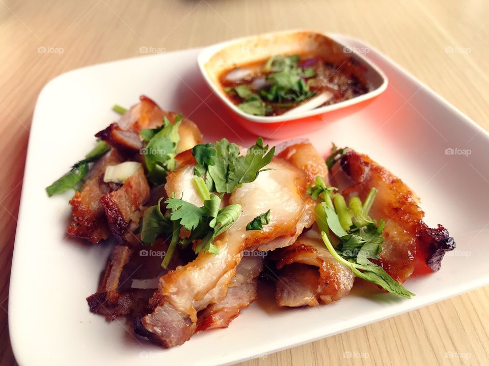 Grilled pork with spicy sauces , very delicious 