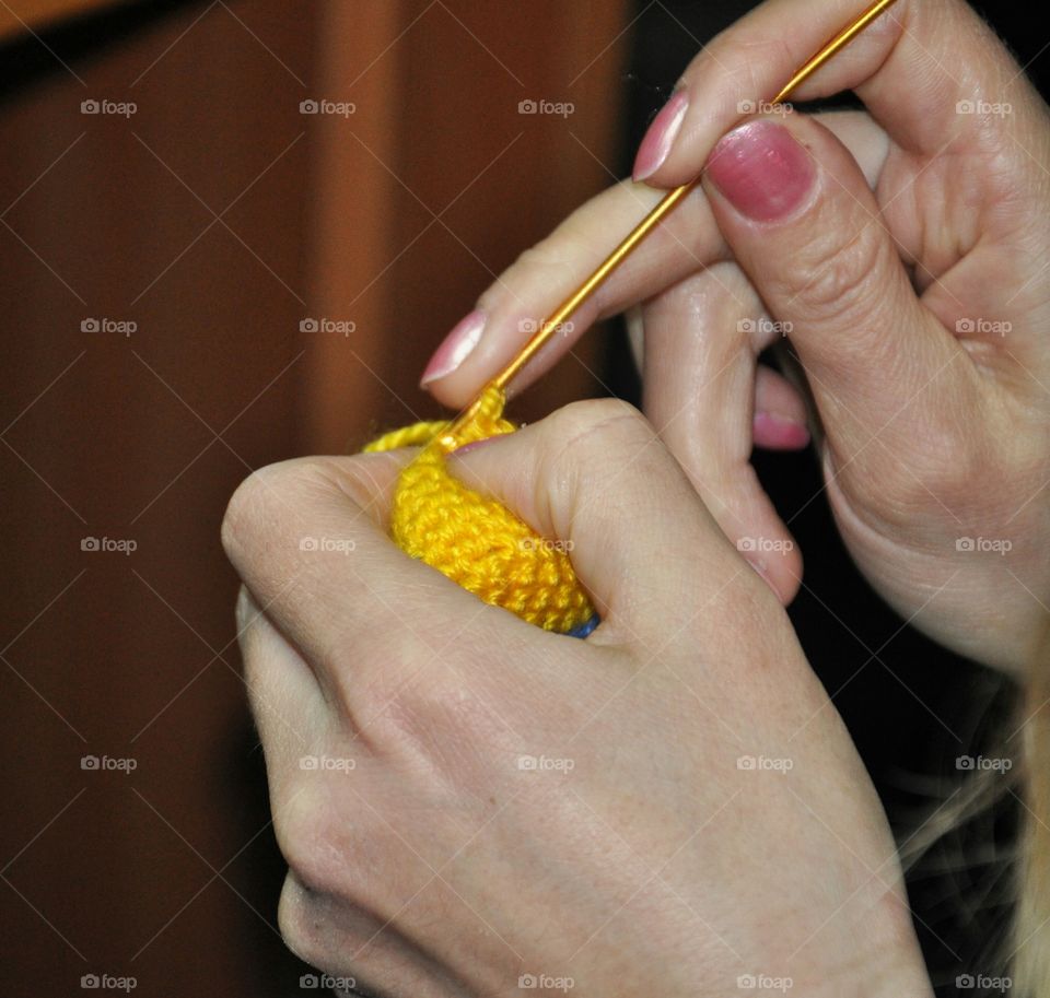 hands knitting something