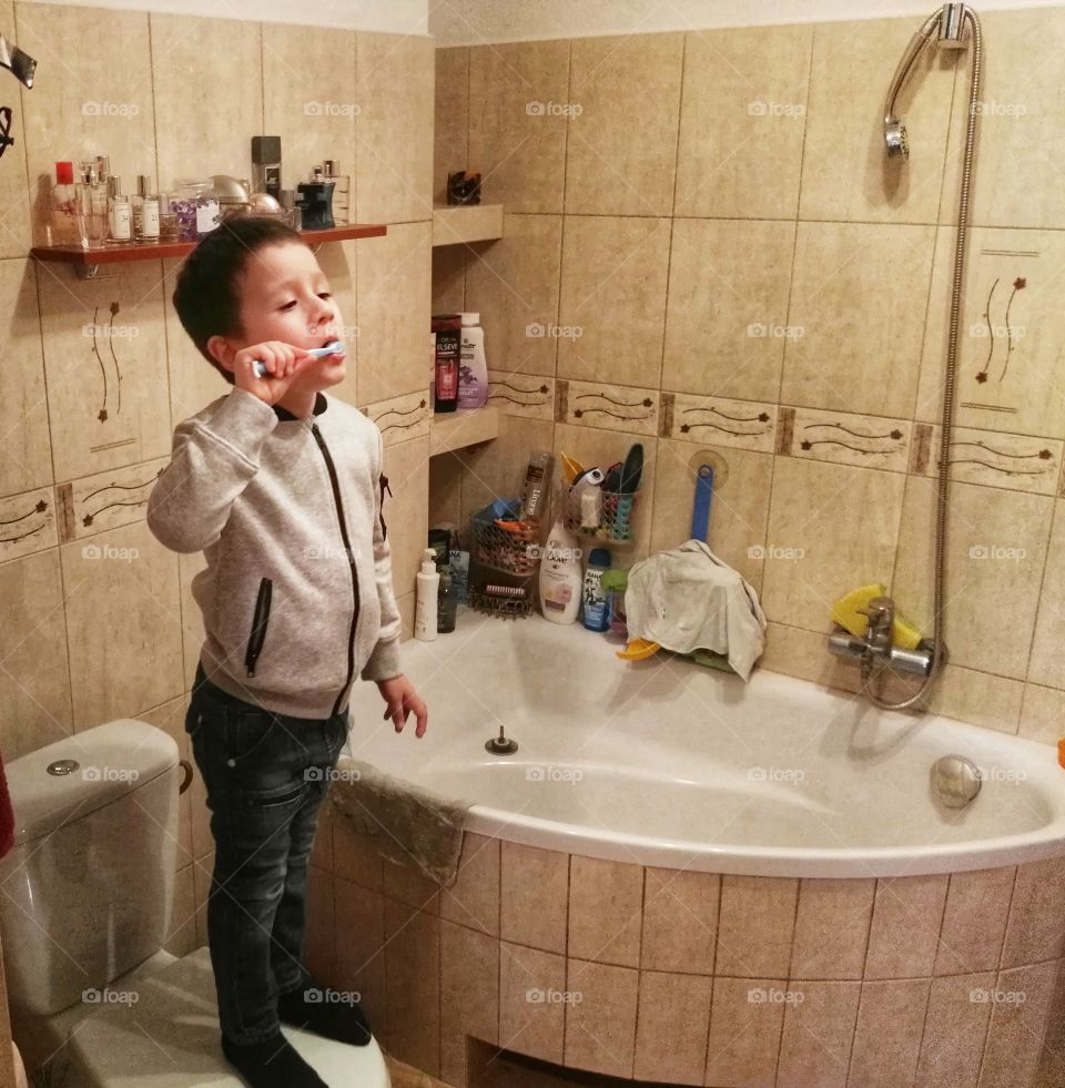 Boy brushing teeth