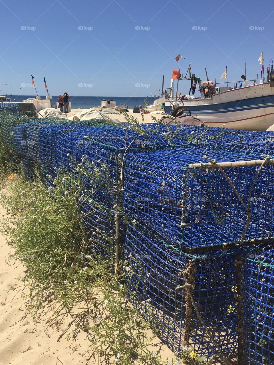 Blue fishermen's traps on beach