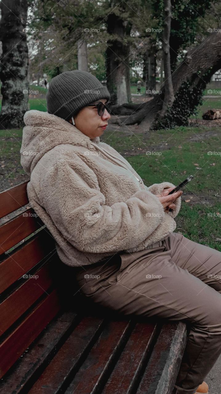 Girl listening to music through her airpods