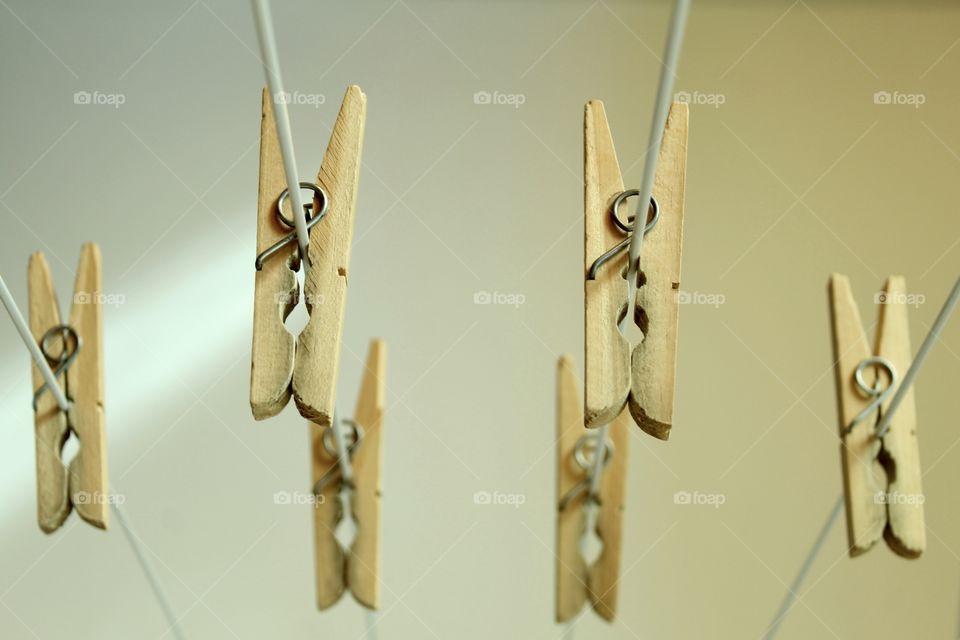 Wooden clothespins on the clothesline 