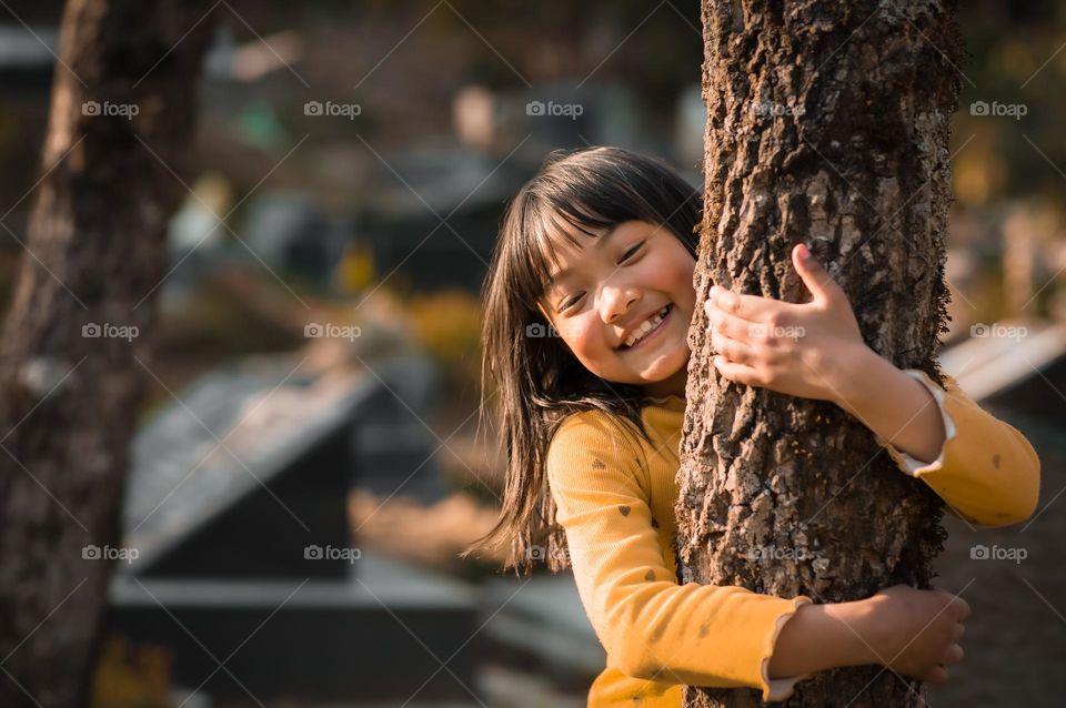 A little girl happy to be outside and having fun, the joy is priceless and so is the emotion.