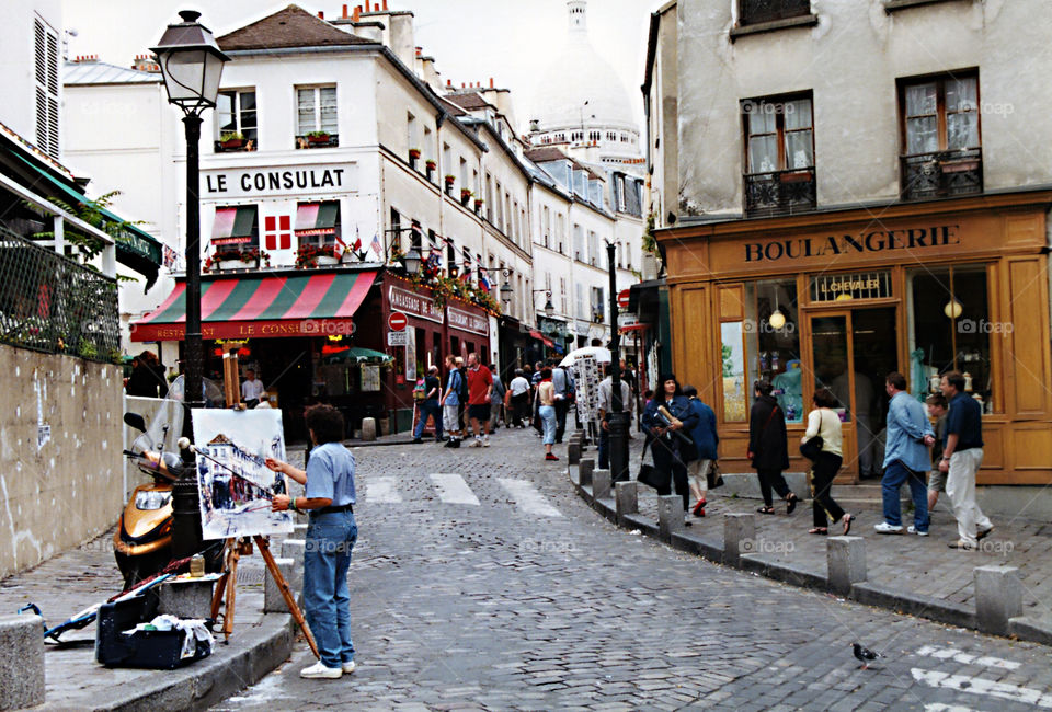 Montmartre Paris. Arriving at Montmartre the first thing I saw was an artist painting the street I was facing.  Had to capture
the moment.