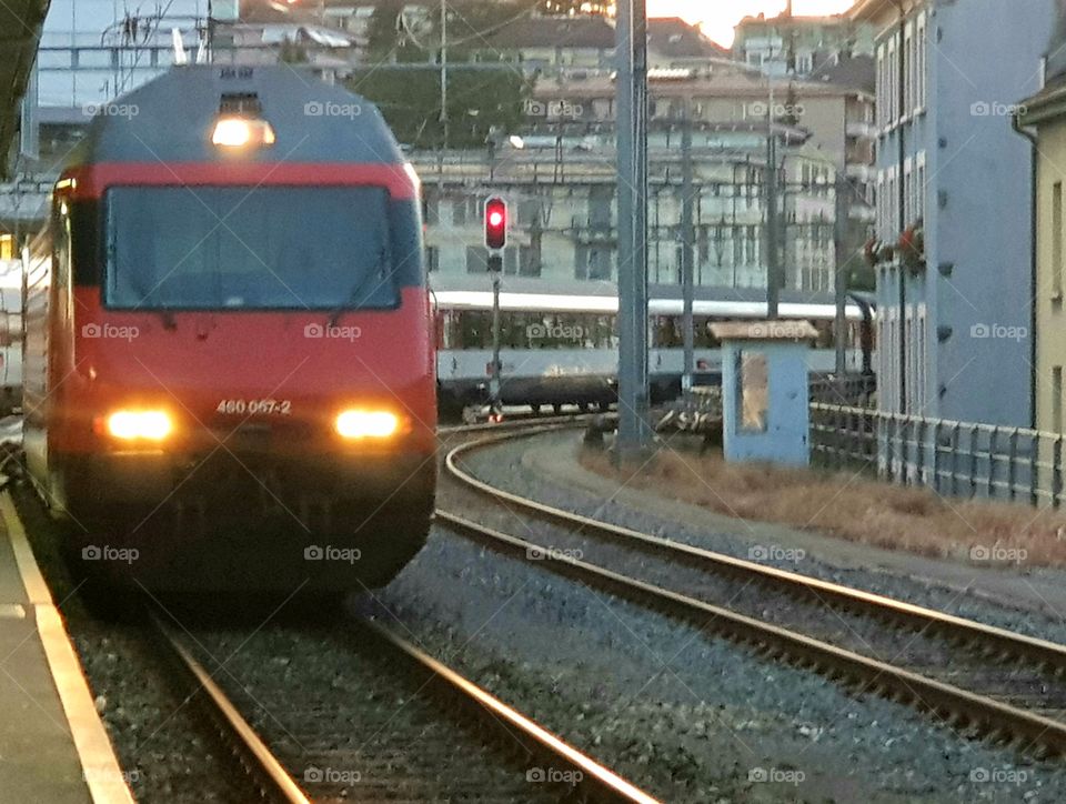 train nearing station in Switzerland