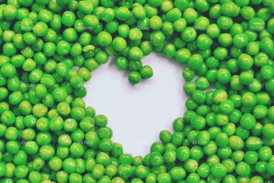Heart-shaped formed by fresh Peas