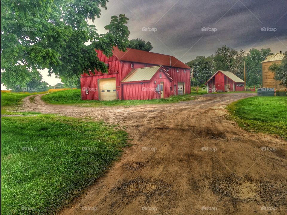 Barn under the storm. Barns underneath a stormy sky 