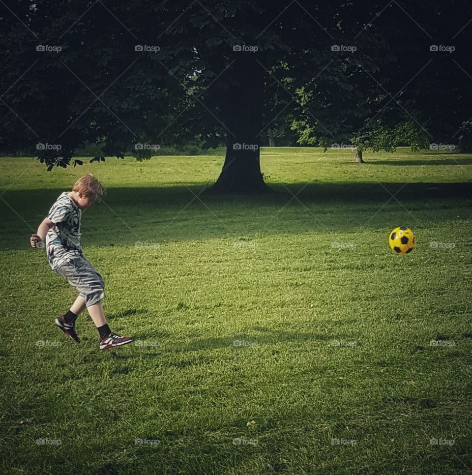 Football in the park. London, UK...