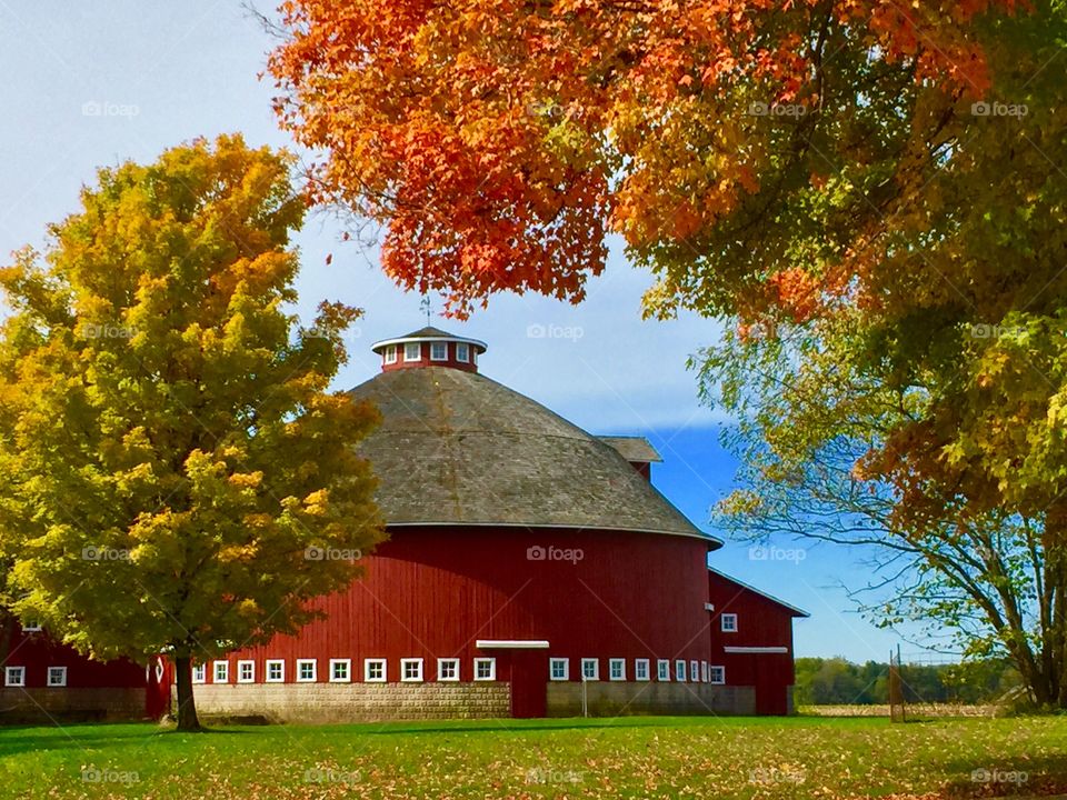 Red round barn in fall
