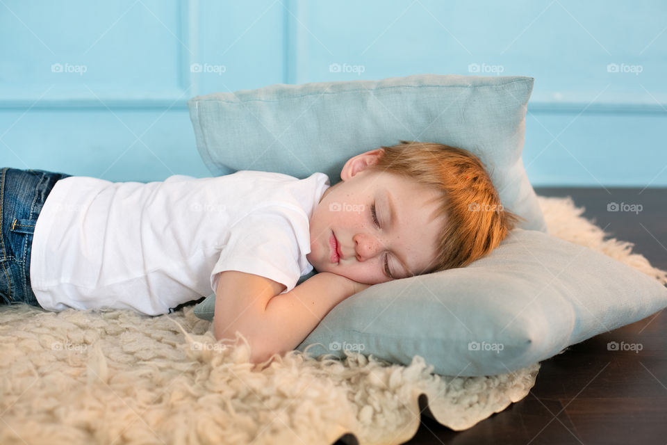 Boy resting on bed