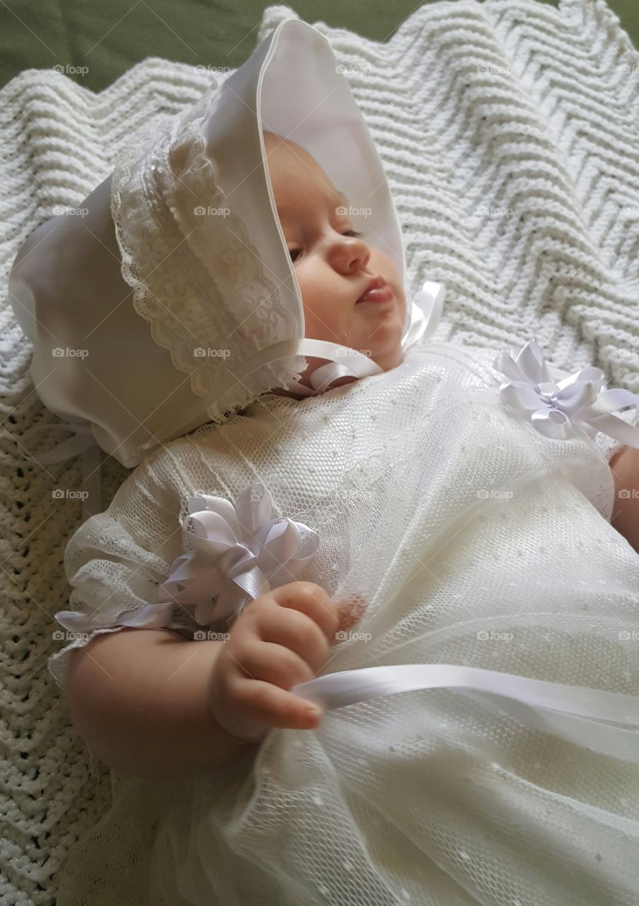 Sweet baby girl in white dress