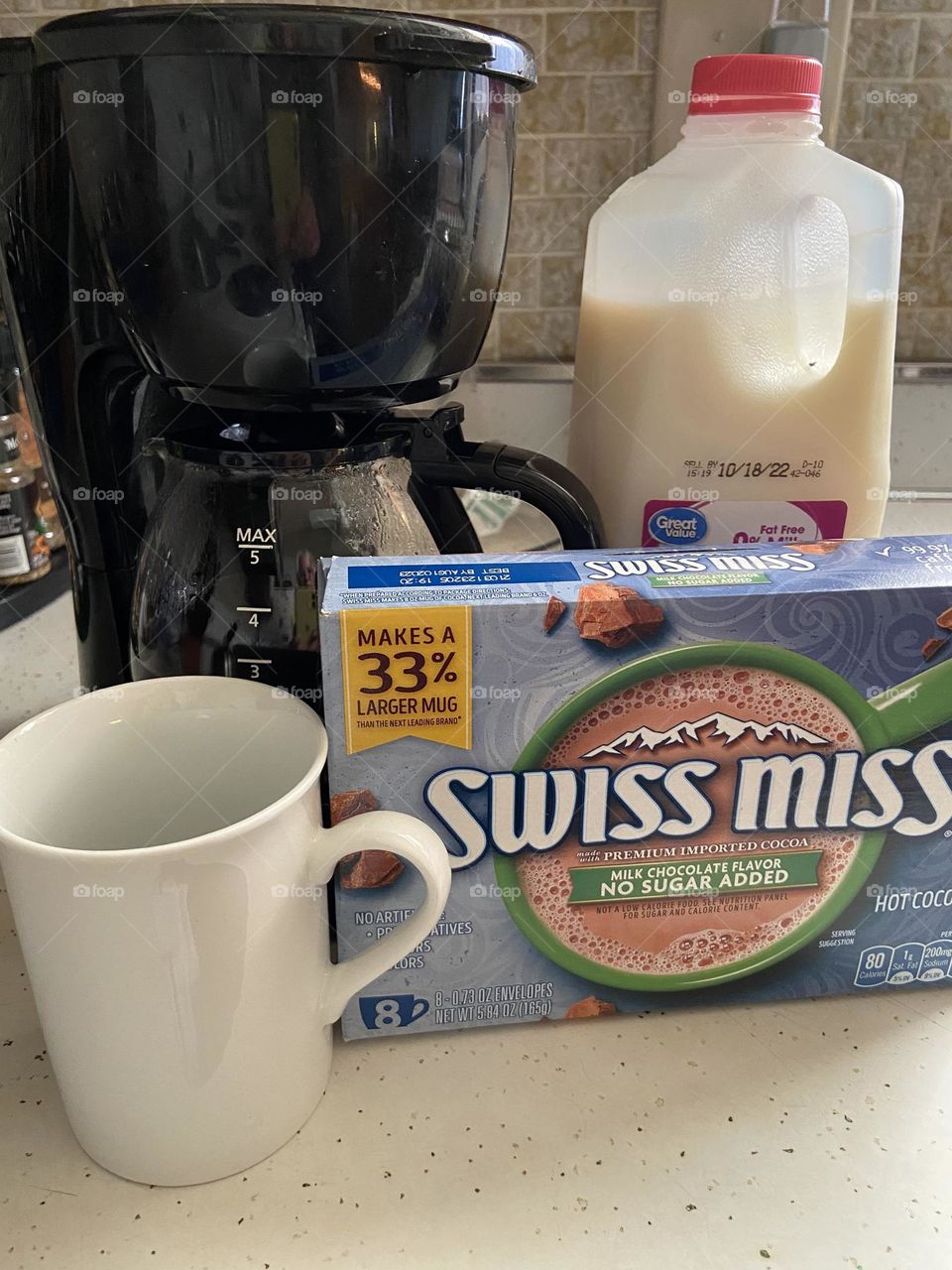 The ingredients for my own homemade version of a mocha:coffee, Swiss Miss hot cocoa mix (any flavor) and milk. I put the cocoa powder in a mug, fill about 3/4 with coffee, add a splash of milk and stir. It’s a delicious treat on a Sunday morning. 
