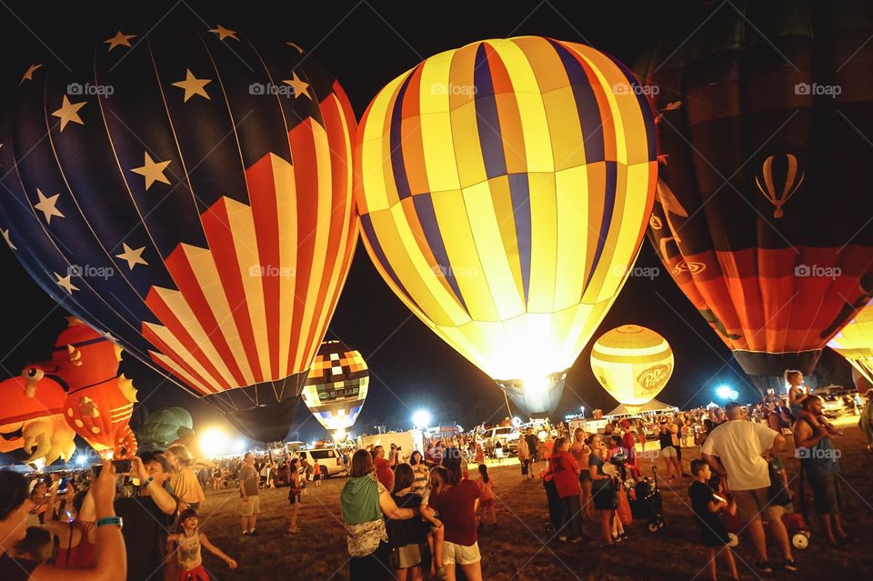 The Balloon Glow at the annual Great Texas Balloon Race, a field of hot air balloons lit up at night