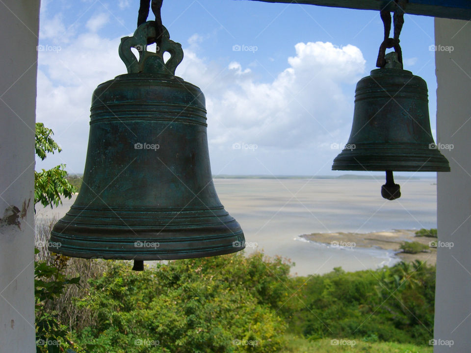 Two bells against beach 