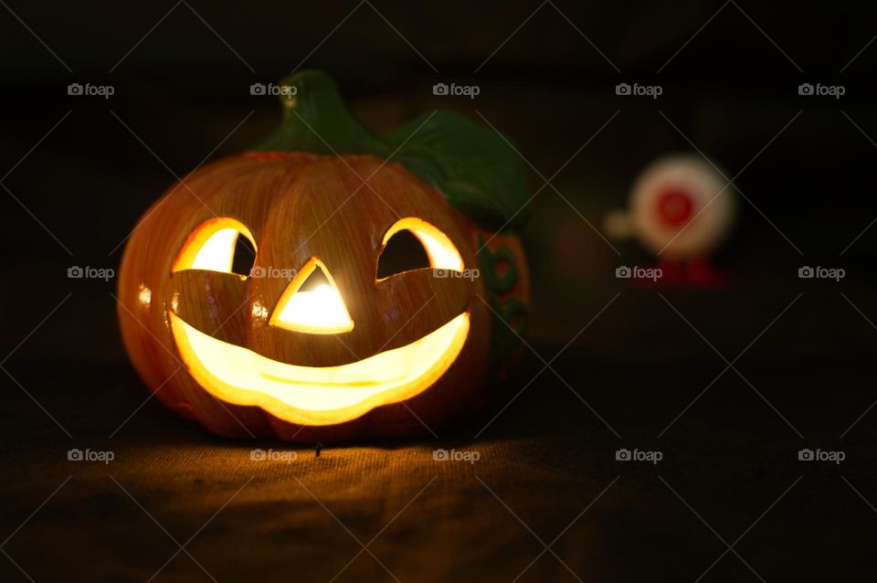 pumpkin lit up on Halloween night