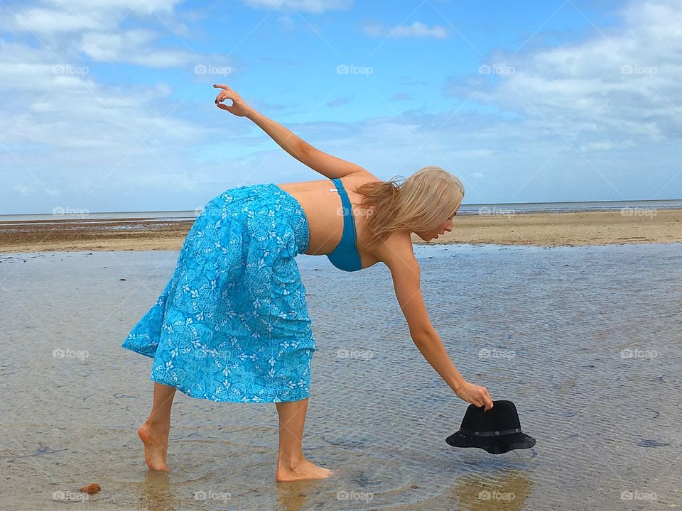 Beautiful woman standing on the beach