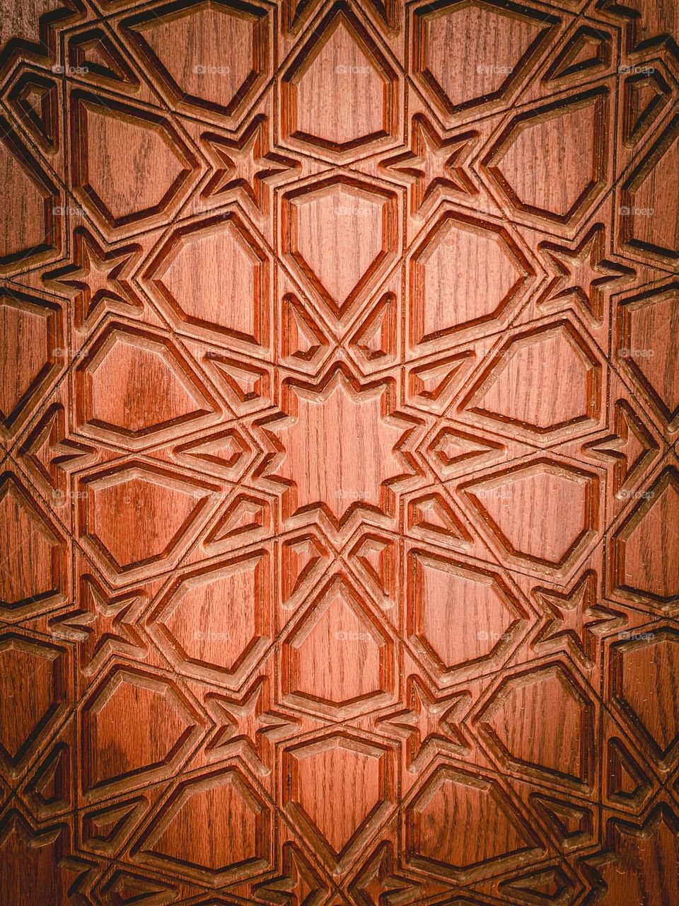 Details. Wooden door with geometric carvings. 