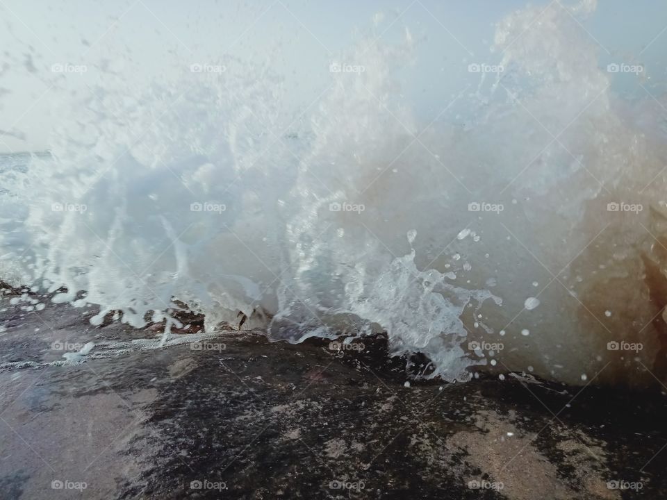 water splashing scene in Aseelah beach Oman
