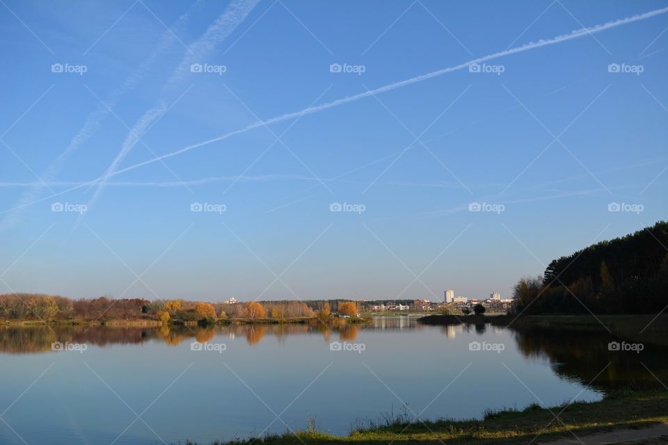 beautiful landscape lake and trees blue sky background autumn time