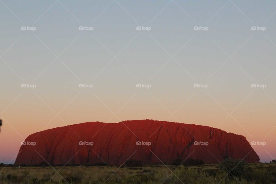 Watching the changing colour as the sun sets over an Aussie icon