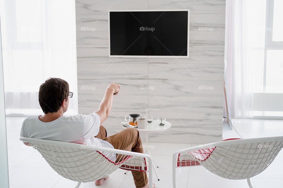 man watching TV