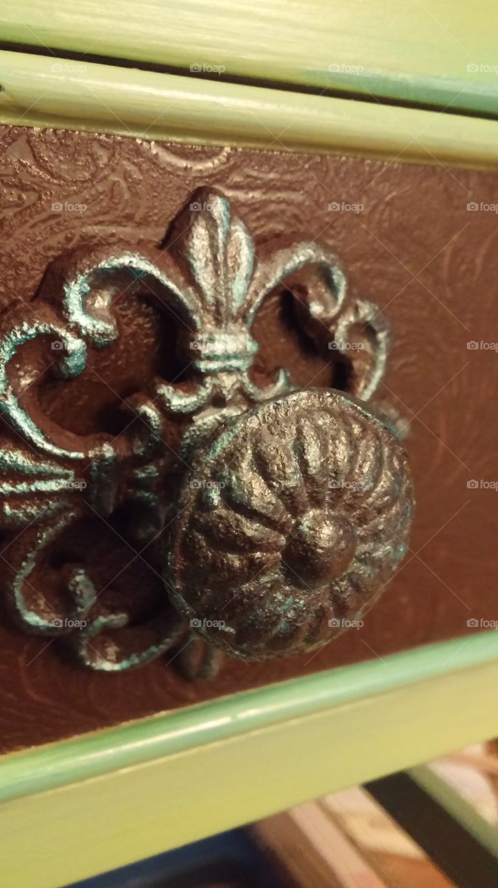 Ornate drawer pull.