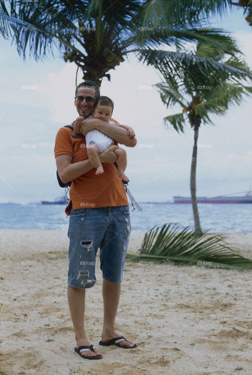 Baby and father on the seafront