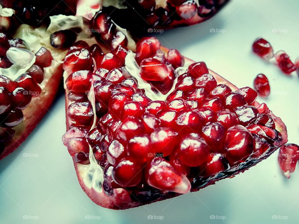 a slice of red juicy pomegranate