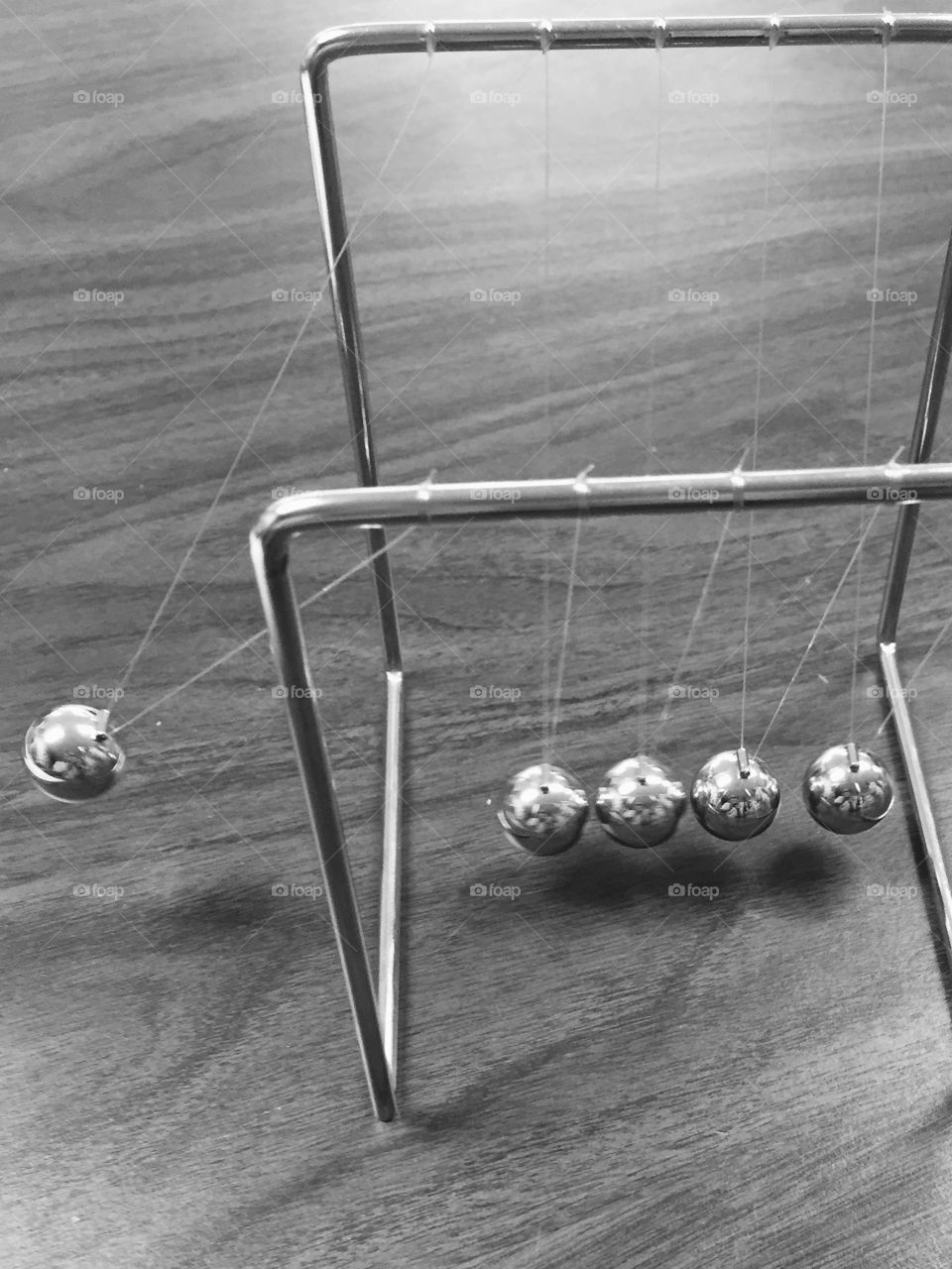 Energy. Newtons cradle black and white 