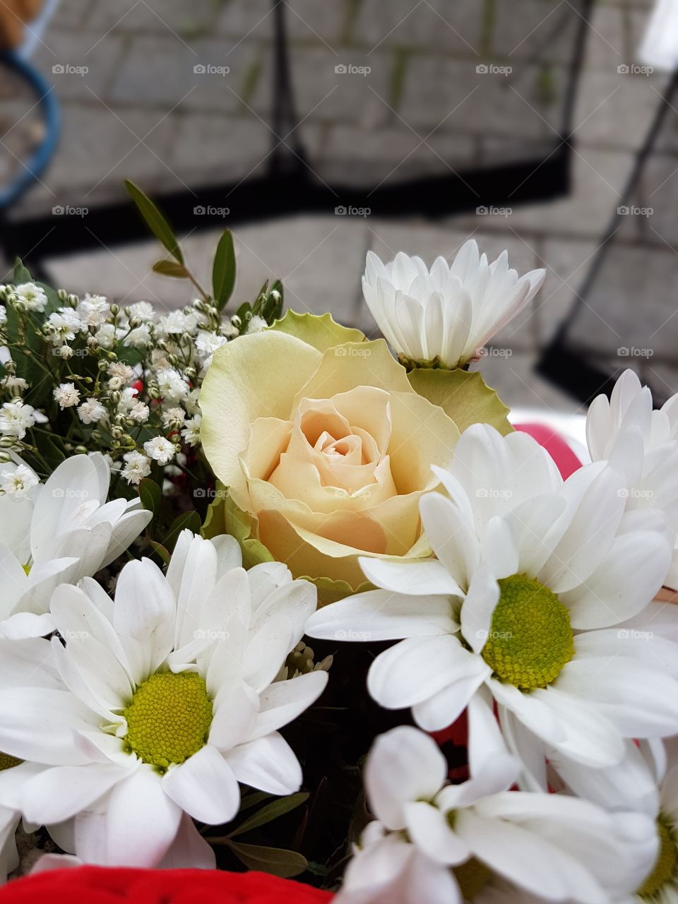 A nice, bright bouquet with a yellow rose. 