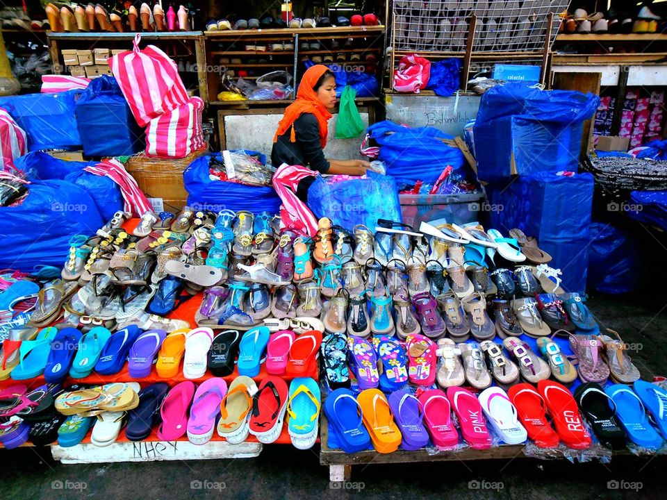 street vendor selling slippers