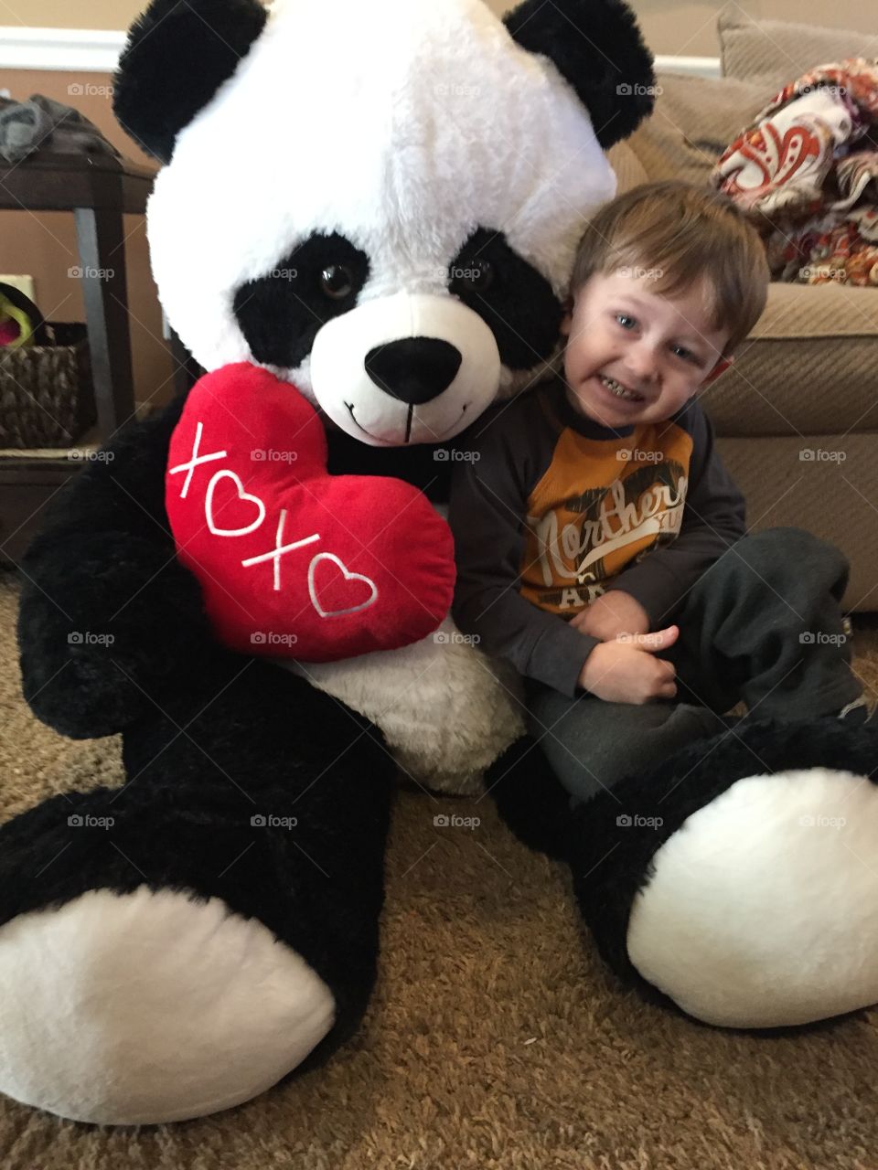 Smiling boy with soft toy