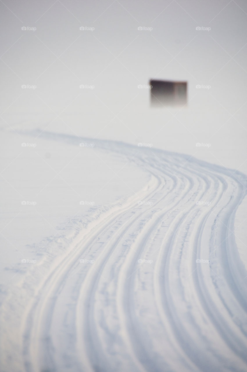 Snowmobiling to your Bobhouse on lake Winnepesaukee