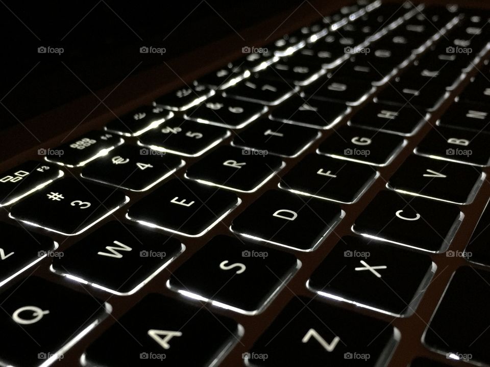 computer keyboard in the dark, with backlight