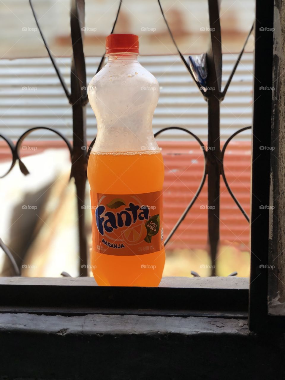 Orange Fanta from Guatemala on a sunny hot day 