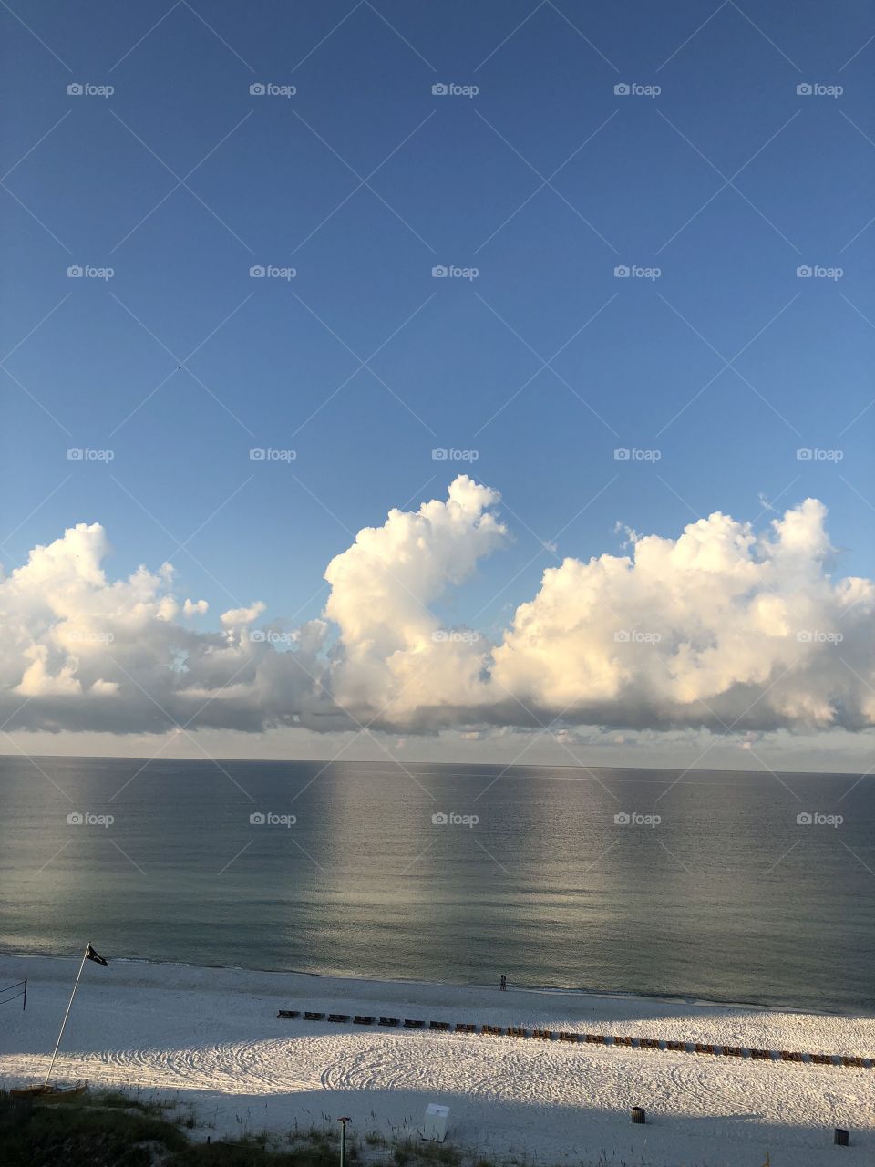 Morning clouds on the ocean. Reflective