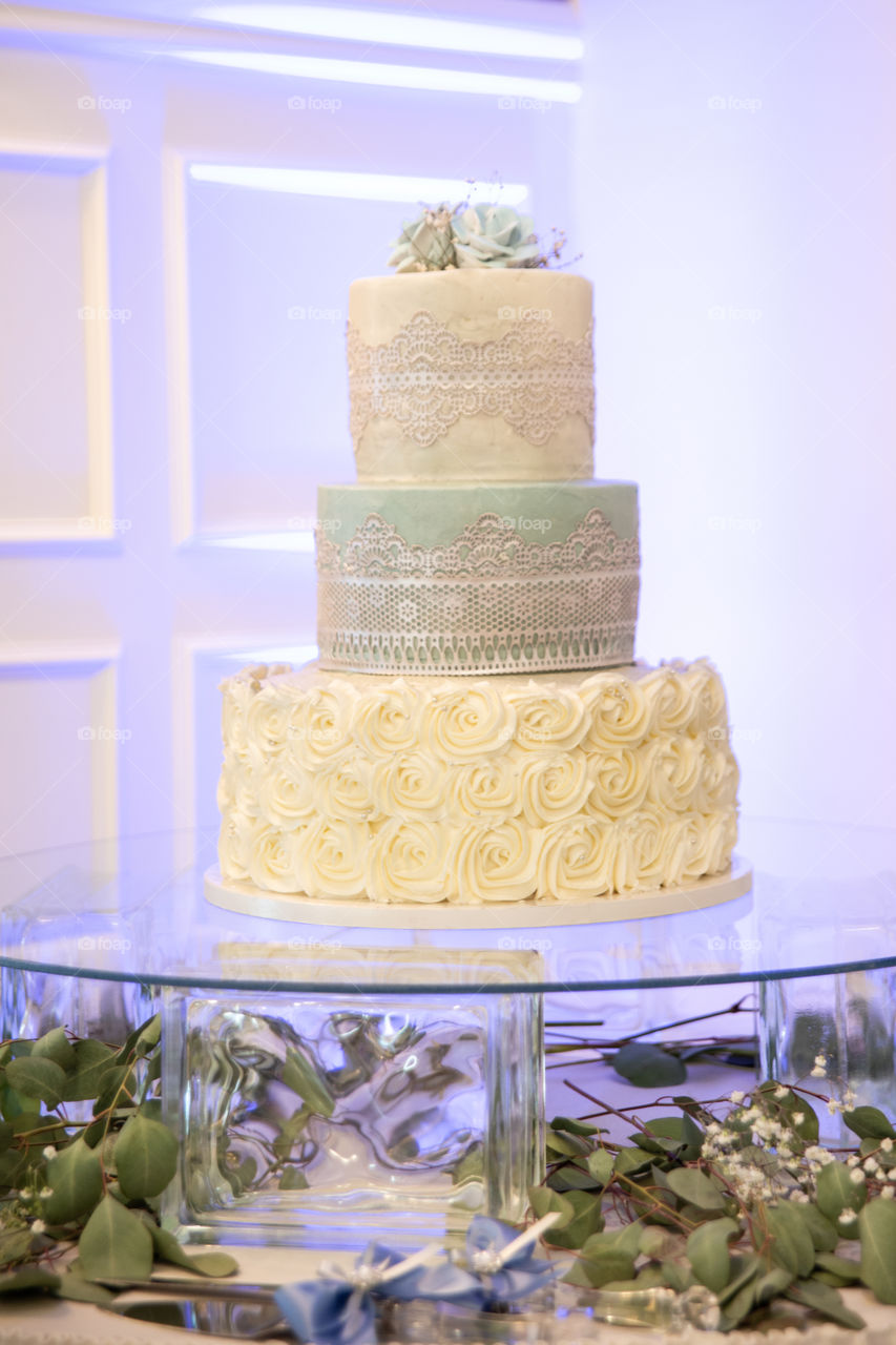 Three tier wedding cake with different styles