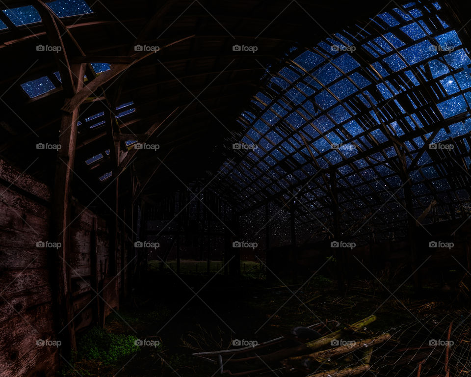 Starry sky seen through abandoned house