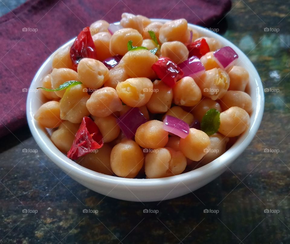 boiled and tempered chickpeas , ready to eat.