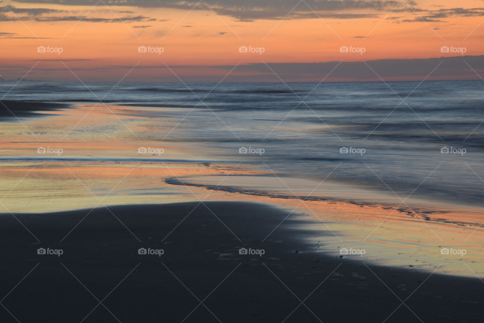 A long exposure of the beach at sunrise 