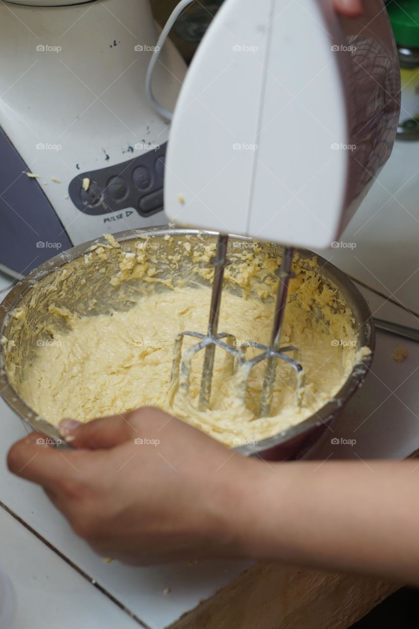 softening the dough using a mixer is one of the processes of making bread