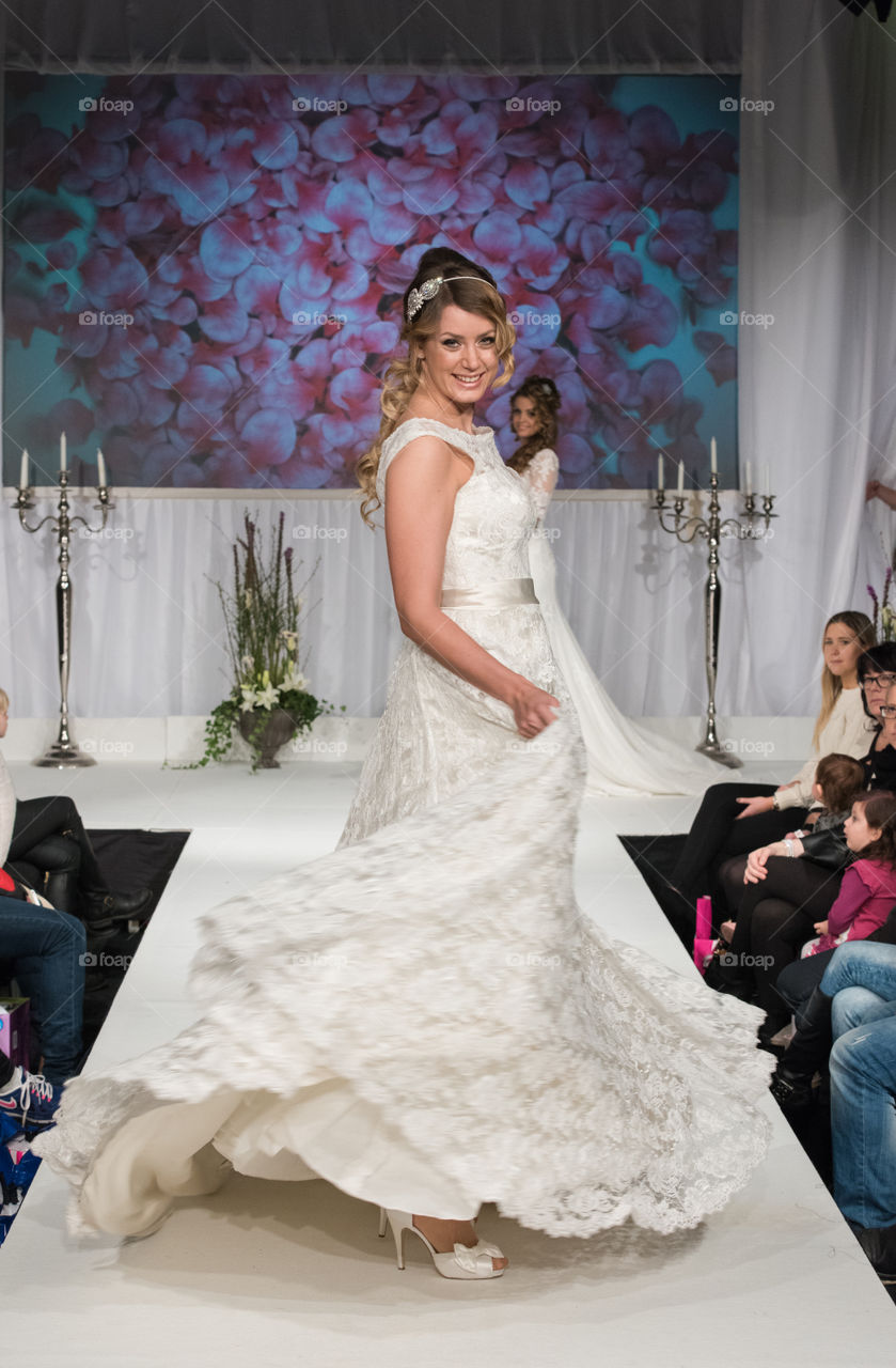 Fashion show at a wedding fair. Here are the latest dresses and clothes for both bride and groom.