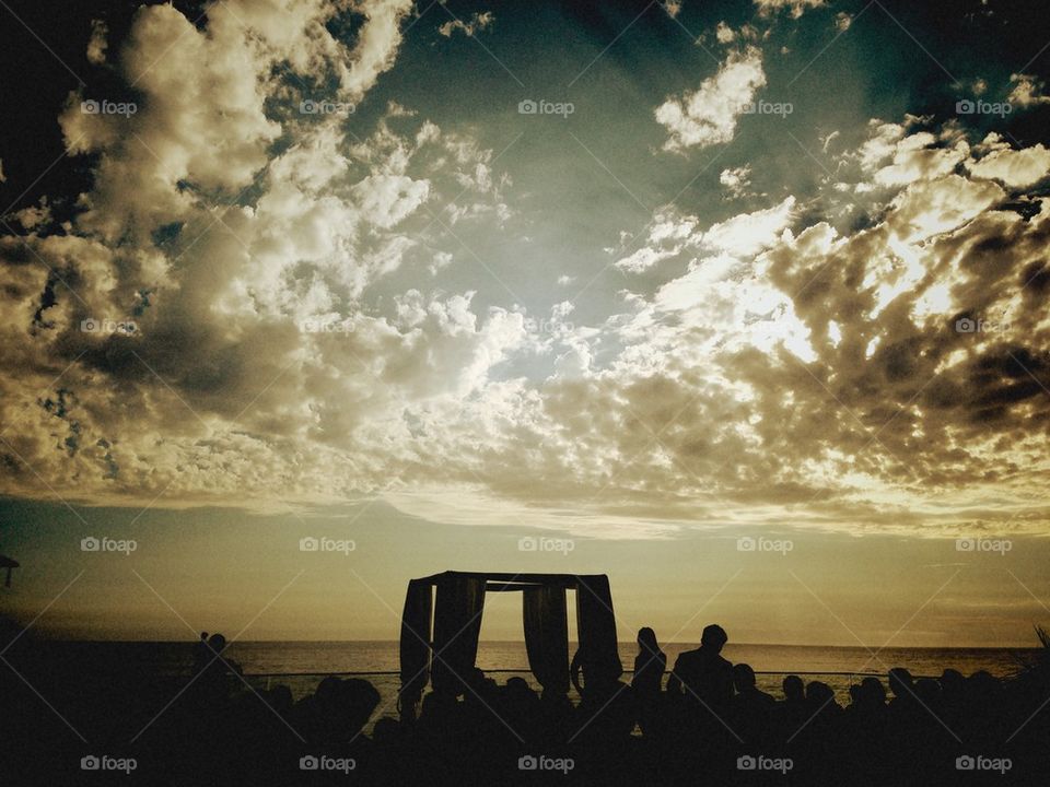 Beach wedding at sunset.