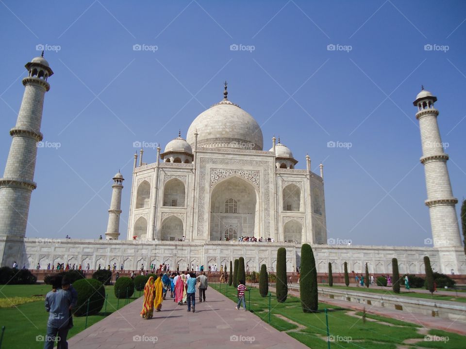 Taj Mahal. 
An epitome of architectural brilliance.  It is in Agra in India and is made of marble.  Shahjahan the mugal emperor built it in memory of his beloved wife Mumtaj Mahal after her death. It's construction was completed at around 1658 AD. It is also a UNESCO would heritage site and a favourite tourist destination.
