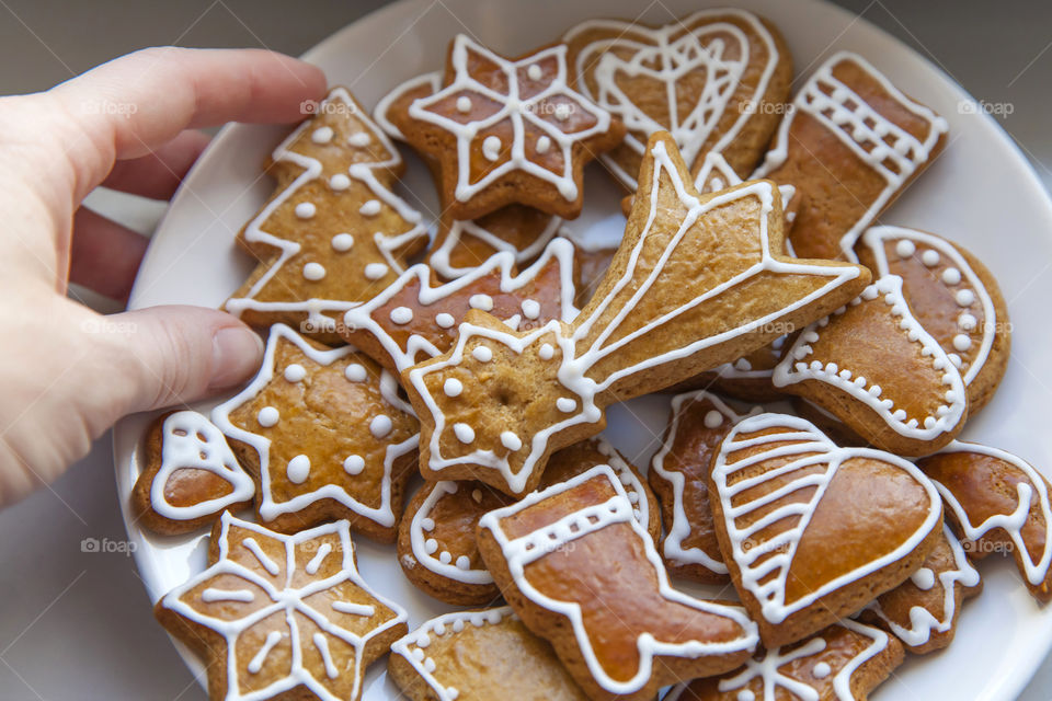 Decorated Christmas cookies on white plate