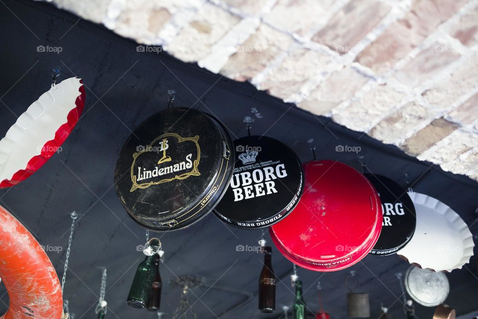 Large bottle caps on the ceiling as decorative element.